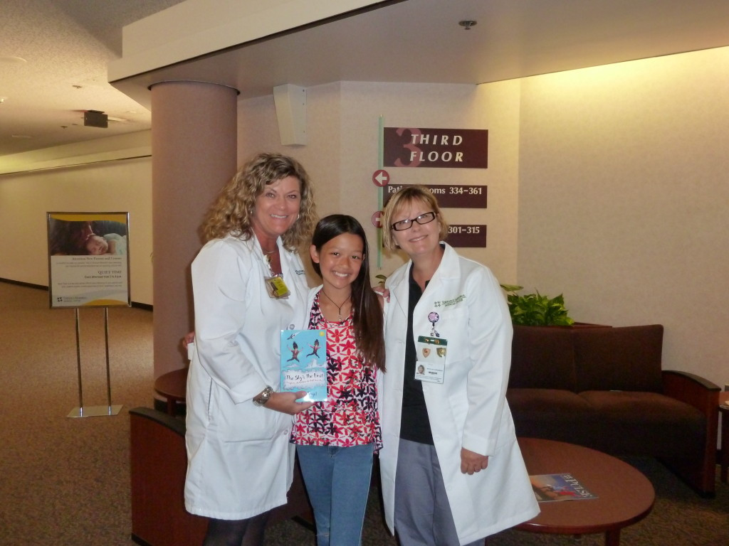 Alexis donating books to Pediatric Dept. at local hospital.